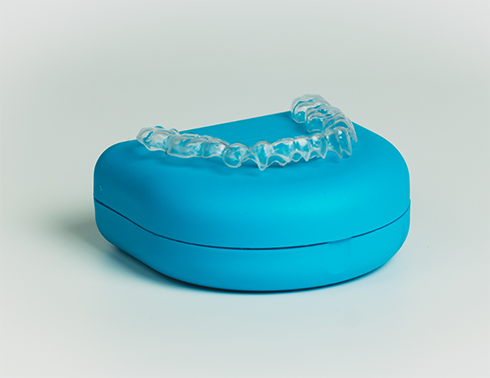 Clear aligner sitting on top of case