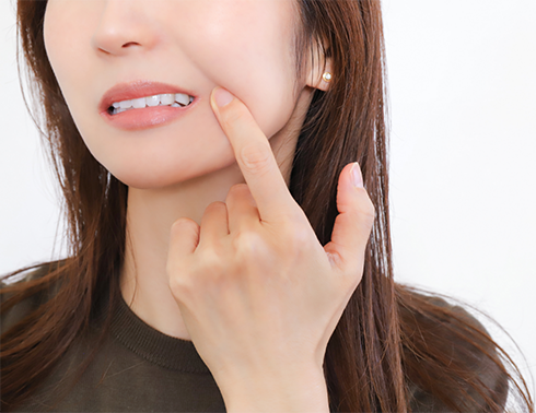 Close up of woman tapping her jaw