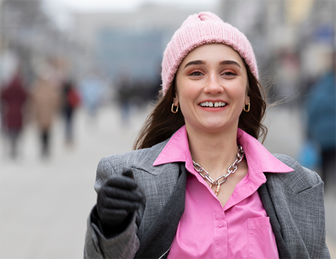 Woman in pink hat with gap between teeth