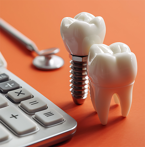 Close up of dental implant and model of tooth next to calculator