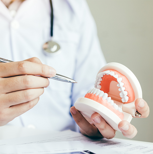 Pointing at denture with pen