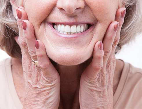 Close up of older woman showing her smile
