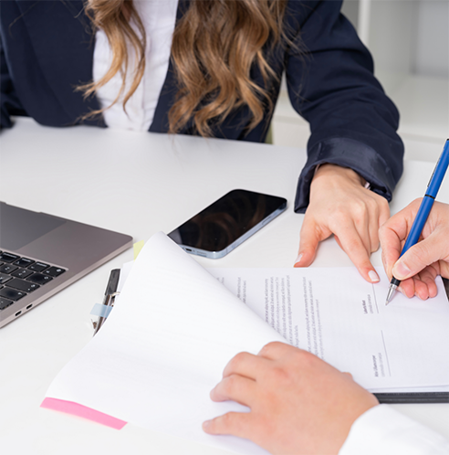 Two people filling out a dental insurance form