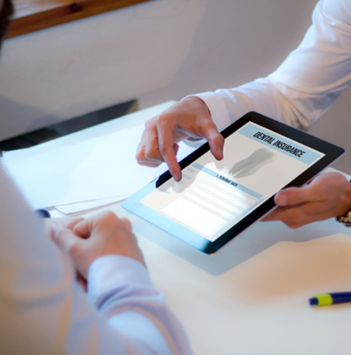 dental team member talking about dental insurance