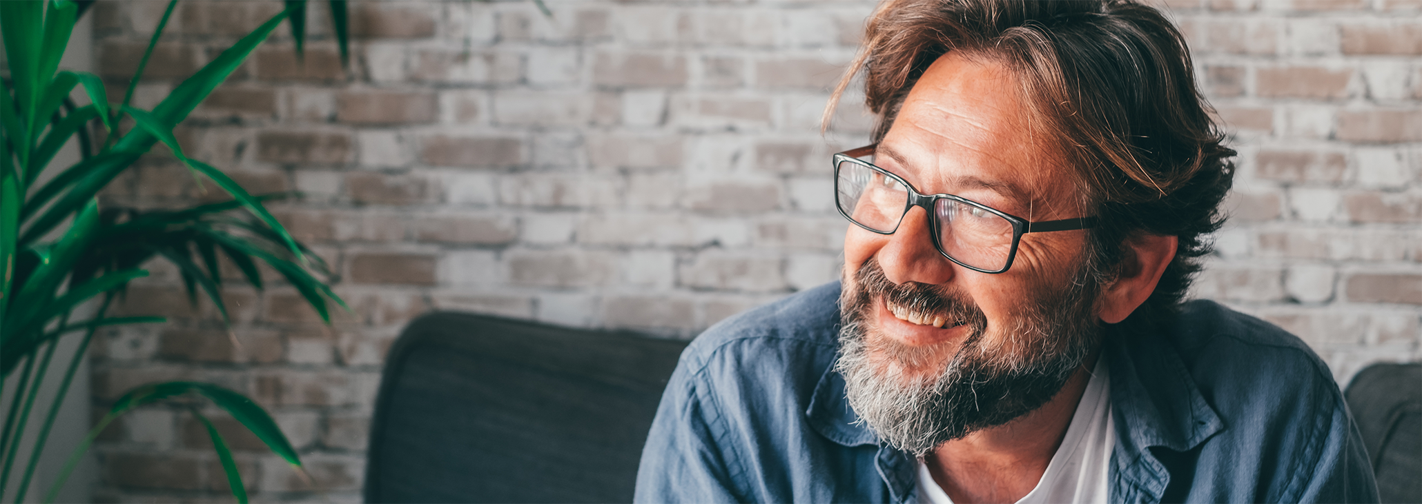 Close up of bearded man with glasses smiling