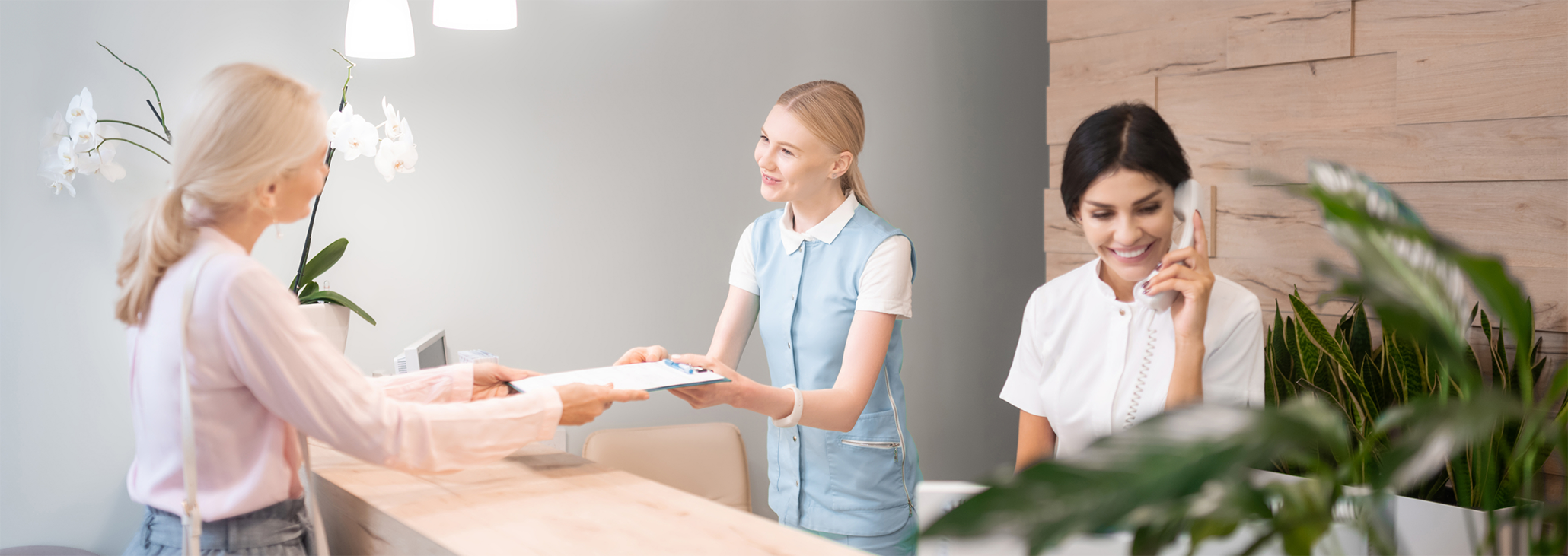 Front desk team member talking on phone
