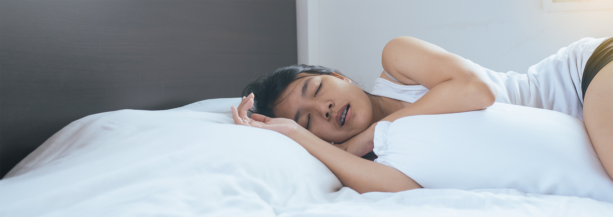 Woman sleeping peacefully on pillow