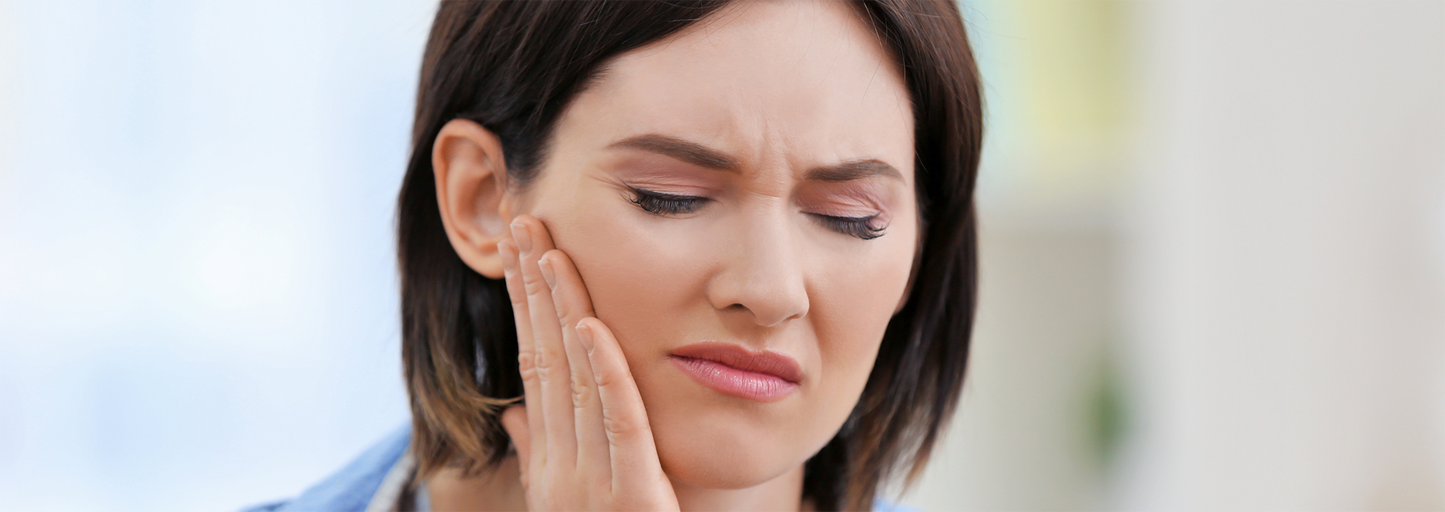 Close up of woman with jaw pain