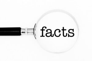magnifying lens on the word facts
